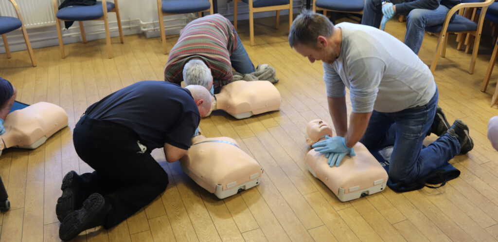 Practicing CPR on our shorebased RYA First Aid Course